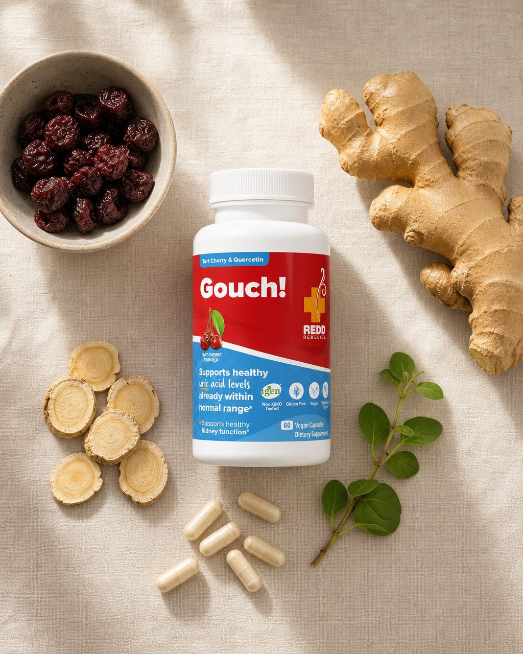 Overhead flat-lay of the Gouch! bottle with tart cherry, ginger, astragalus root, boerhavia, and vegan capsules